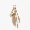 Chloé Symbols pirinç ve koyun postundan yapılmış çanta süsü Chloé Symbols pirinç ve koyun postundan yapılmış çanta süsü