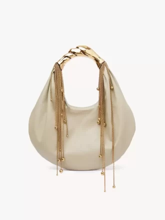 Parlak deriden yapılmış Twisted Shell hobo çanta