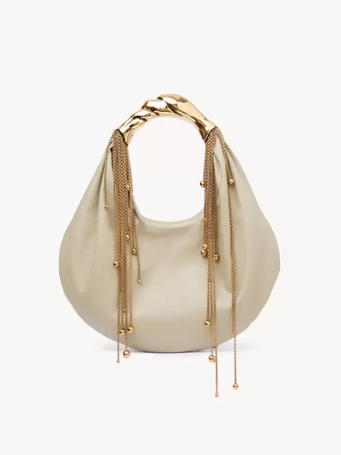 Parlak deriden yapılmış Twisted Shell hobo çanta Parlak deriden yapılmış Twisted Shell hobo çanta