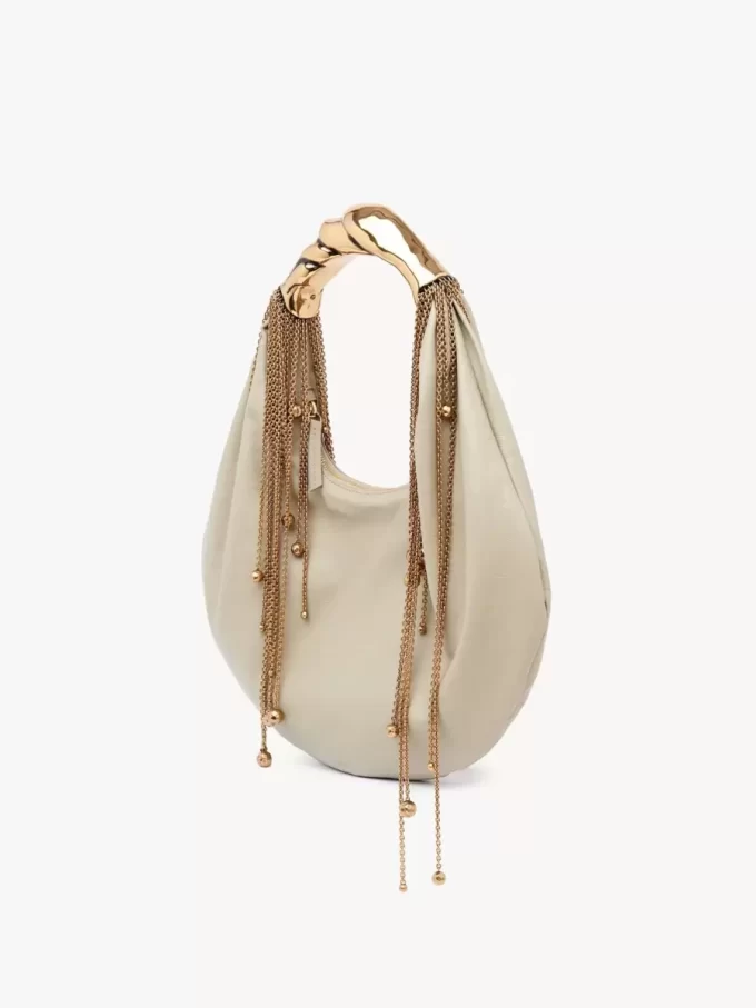 Parlak deriden yapılmış Twisted Shell hobo çanta Parlak deriden yapılmış Twisted Shell hobo çanta