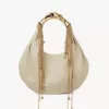 Parlak deriden yapılmış Twisted Shell hobo çanta Parlak deriden yapılmış Twisted Shell hobo çanta