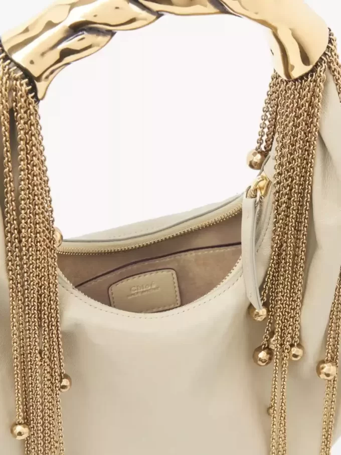 Parlak deriden yapılmış Twisted Shell hobo çanta Parlak deriden yapılmış Twisted Shell hobo çanta
